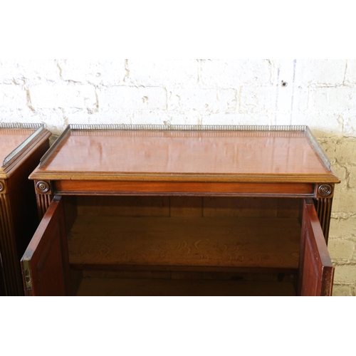 393 - Pair of 19th century Regency style mahogany side cabinets, the rectangular tops with pierced brass t... 