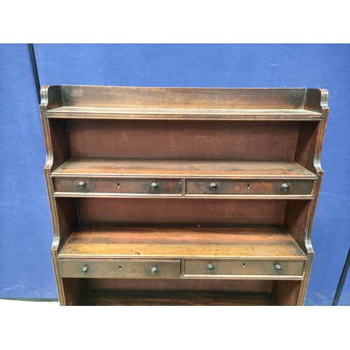 370 - 19th Century mahogany waterfall bookcase with open shelving interspersed with three pairs of small d... 