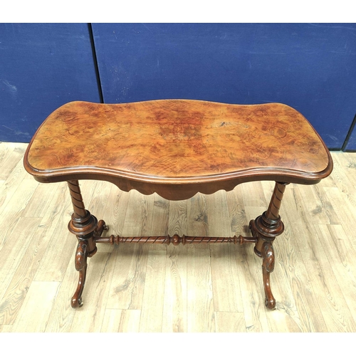 373 - Victorian figured walnut occasional table with shaped top, on turned columns and scroll feet with ce... 