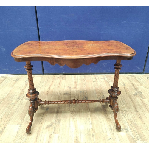 373 - Victorian figured walnut occasional table with shaped top, on turned columns and scroll feet with ce... 