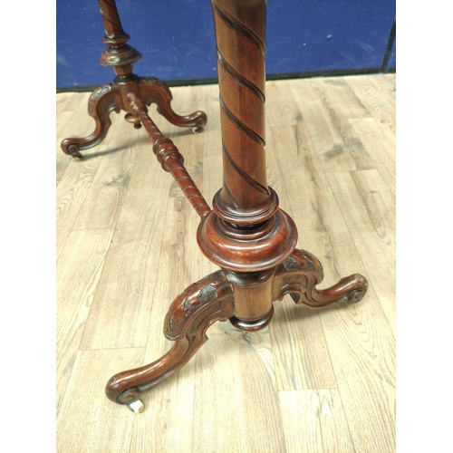 373 - Victorian figured walnut occasional table with shaped top, on turned columns and scroll feet with ce... 