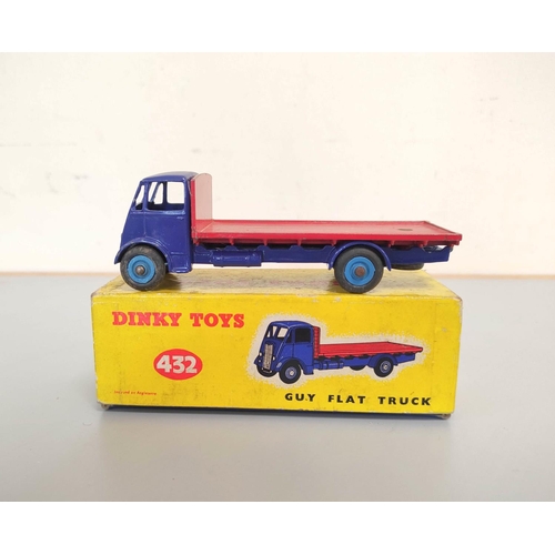 16 - Dinky Toys. Boxed diecast Guy Flat Truck no 432 with blue cab & red bed. Also three others loose... 