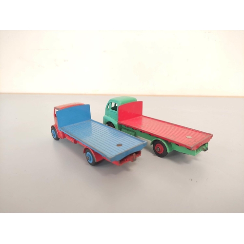 16 - Dinky Toys. Boxed diecast Guy Flat Truck no 432 with blue cab & red bed. Also three others loose... 