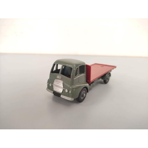 16 - Dinky Toys. Boxed diecast Guy Flat Truck no 432 with blue cab & red bed. Also three others loose... 
