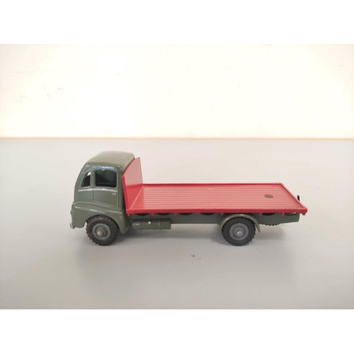 16 - Dinky Toys. Boxed diecast Guy Flat Truck no 432 with blue cab & red bed. Also three others loose... 