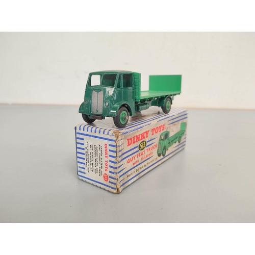 18 - Dinky Toys. Boxed diecast Guy Flat Truck with Tailboard no 513 with dark green cab & light green... 