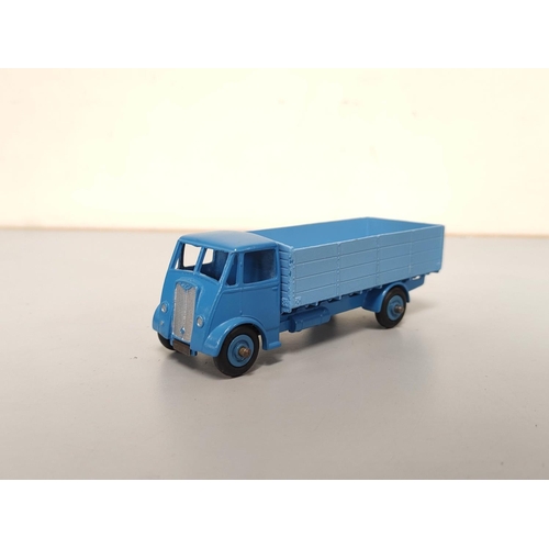 21 - Dinky Toys. Group of die-cast vehicles to include Guy 4-Ton Lorry no 511, Foden Flat Truck With Tail... 