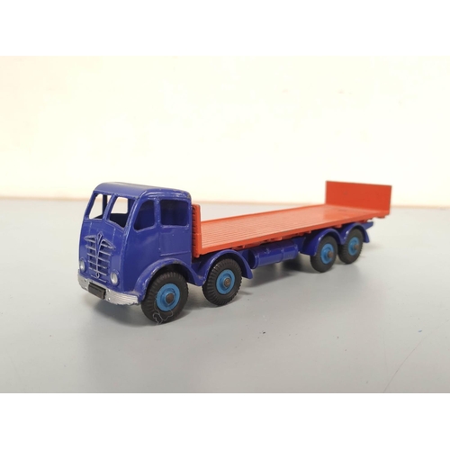 21 - Dinky Toys. Group of die-cast vehicles to include Guy 4-Ton Lorry no 511, Foden Flat Truck With Tail... 
