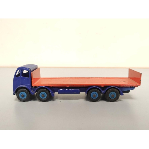 21 - Dinky Toys. Group of die-cast vehicles to include Guy 4-Ton Lorry no 511, Foden Flat Truck With Tail... 