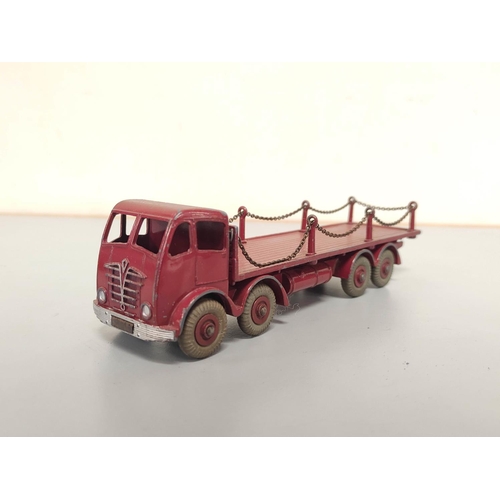 21 - Dinky Toys. Group of die-cast vehicles to include Guy 4-Ton Lorry no 511, Foden Flat Truck With Tail... 