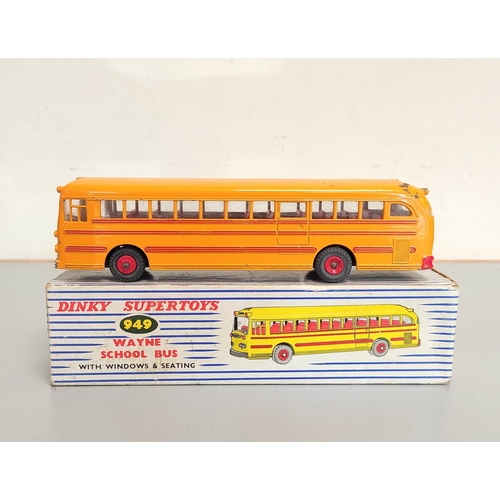 9 - Dinky Toys. Boxed Wayne School Bus with Windows and Seating No. 949, yellow body with red interior.... 