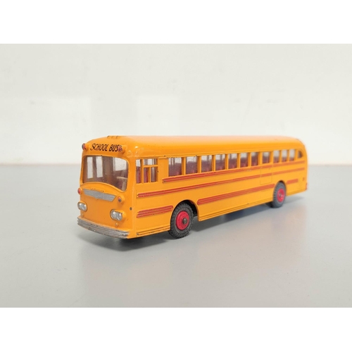 9 - Dinky Toys. Boxed Wayne School Bus with Windows and Seating No. 949, yellow body with red interior.... 