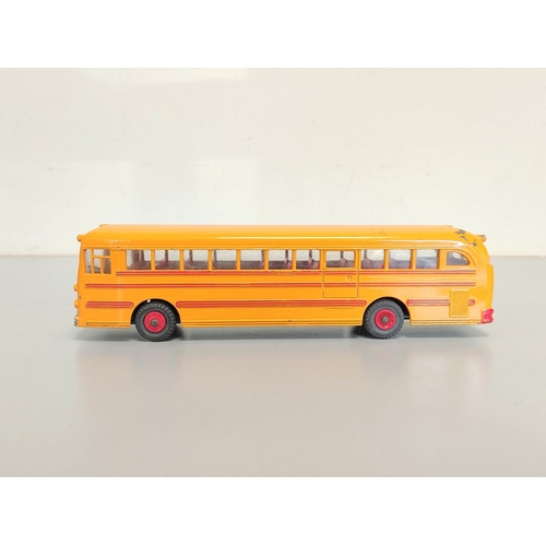 9 - Dinky Toys. Boxed Wayne School Bus with Windows and Seating No. 949, yellow body with red interior.... 