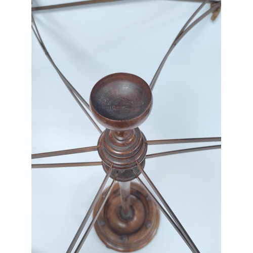 178 - Antique mahogany wool winder with extending sticks above galleried undertier raised on balustrade co... 