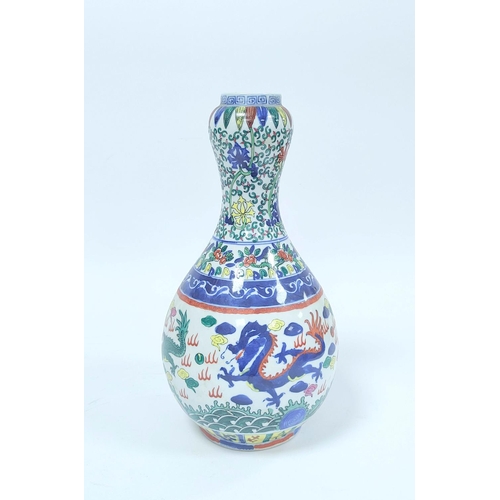 351 - Chinese Wanli style vase painted in the Doucai palette with garlic mouth, Decorated with artisan lea... 