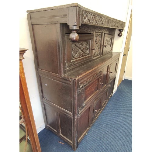 374 - Antique oak court cupboard inscribed to the frieze with initials and dated 1691, above foliate carvi... 