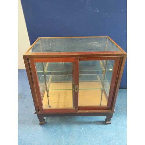 377 - Vintage mahogany glazed shop cabinet of square size, sliding doors to the reverse, glazed allover wi... 