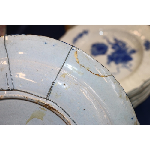 266 - Three 18th century Delft pottery plates, matching cobalt blue and white design, 31cm diameter.  (3) ... 