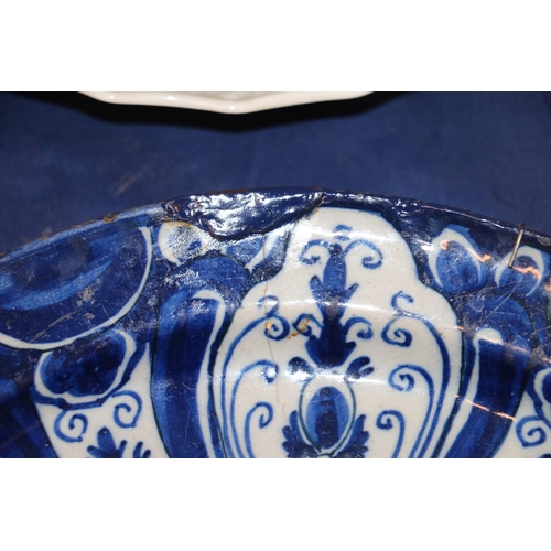 266 - Three 18th century Delft pottery plates, matching cobalt blue and white design, 31cm diameter.  (3) ... 