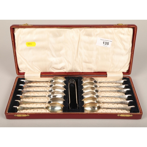 135 - Set of 12 EPNS teaspoons with sugar tongs in case.