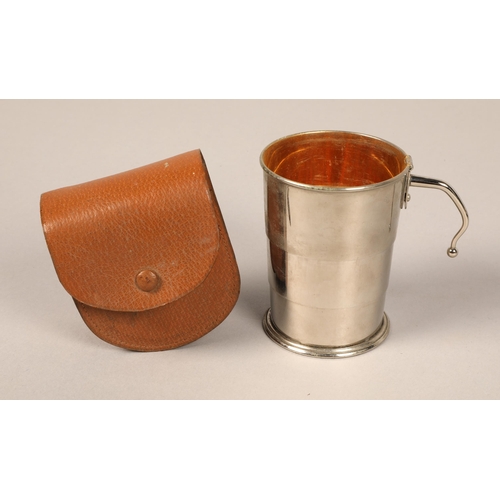 138 - Silver topped whisky tot and label, portable silver cup with leather case, silver matchbox cover, si... 