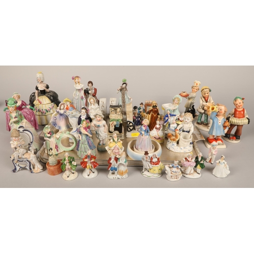 145 - Large quantity of small figurines including Hummel and other German, continental, etc