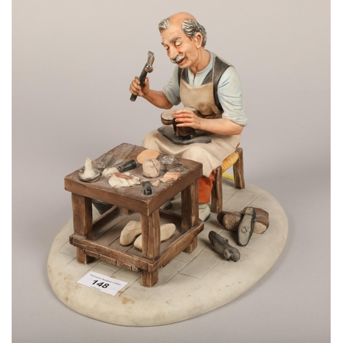 148 - Capodimonte figure of a cobbler, 21cm high