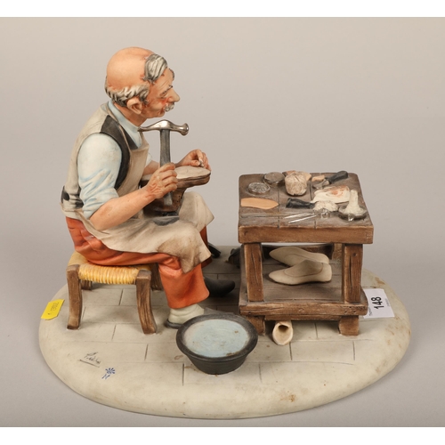 148 - Capodimonte figure of a cobbler, 21cm high