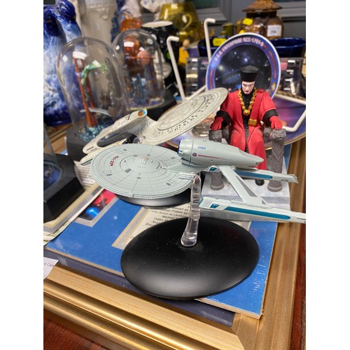 295 - Assorted Star Trek memorabilia including mugs, models, plates, etc. and three glass domed ltd editio... 