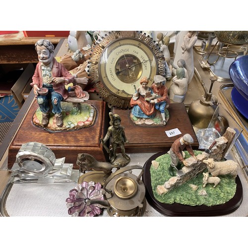 257 - Gischard barometer, assorted brass, decorative items, and figures on wooden stands, etc.