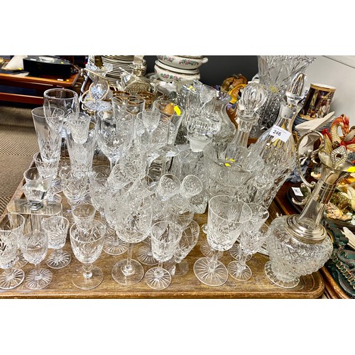 246 - Assortment of cut glass and decanters .