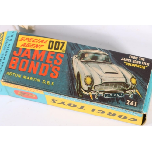 105 - Corgi Toys: James Bond Aston Martin DB5 die-cast scale model, number 261. Original paper elements ar... 