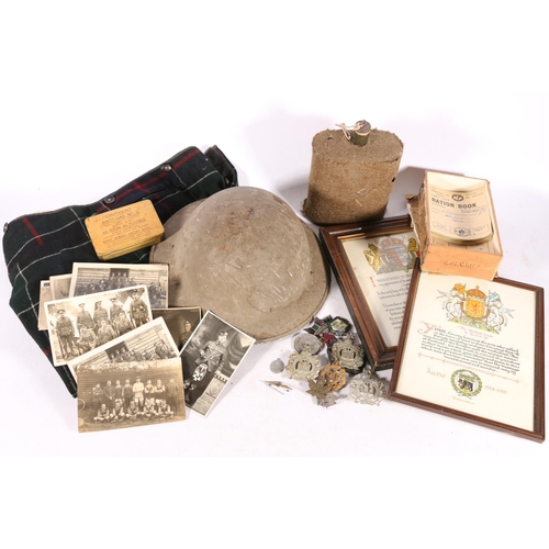 14 - WWII helmet, a water canteen, and cap badges to include KOSB, along with WWI and WWII ephemera to in... 