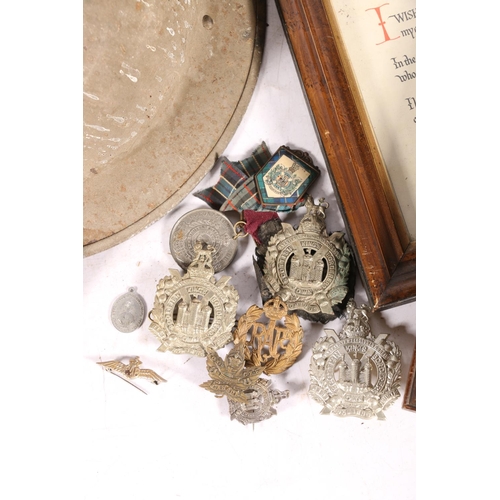 14 - WWII helmet, a water canteen, and cap badges to include KOSB, along with WWI and WWII ephemera to in... 