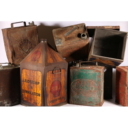 19 - Nine vintage petroleum and oil cans to include Shell, Pratt and BP, etc.