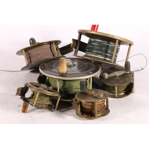 Five antique fishing reels to include Hogg, Anderson & Sons