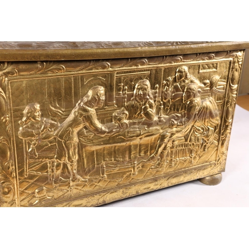 38 - Brass embossed log box depicting a classical scene, 47cm wide.