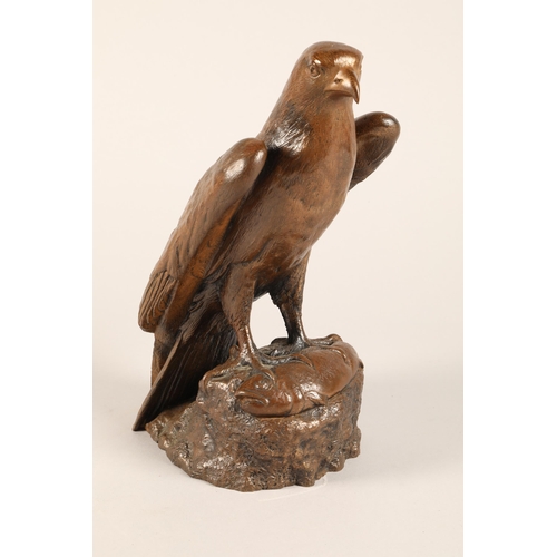 218 - Bronzed resin sculpture of a falcon, 30cm h