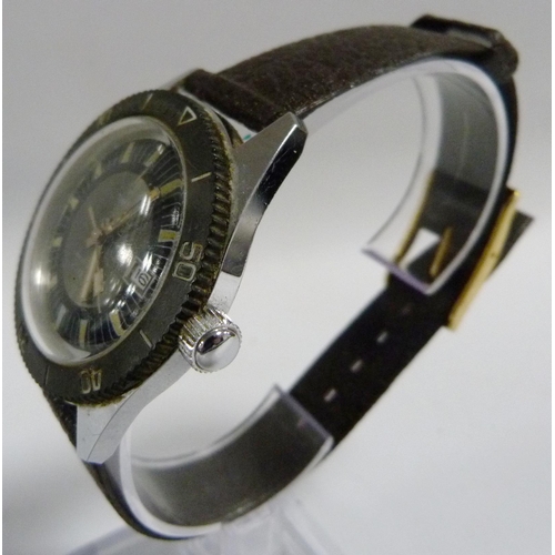 39 - Timex: Water resistant 25 metres divers style wristwatch circa 1970s, stainless case with black beze... 