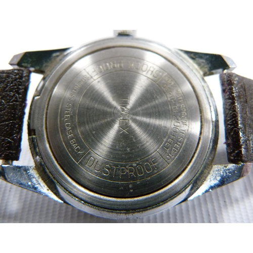 39 - Timex: Water resistant 25 metres divers style wristwatch circa 1970s, stainless case with black beze... 