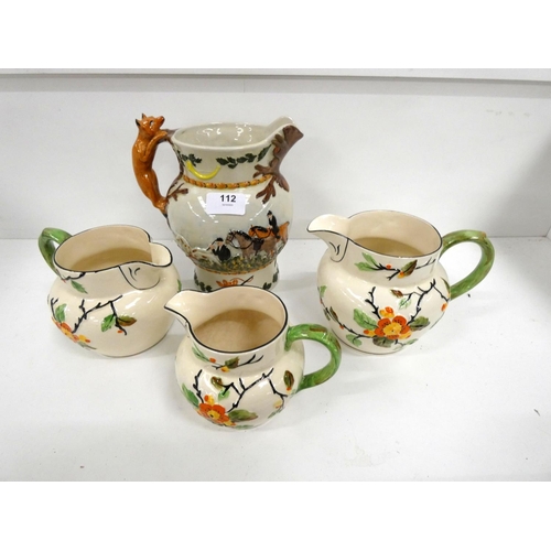 112 - Staffordshire hunting tankard jug and three graduated blossom TFS Ltd jugs.