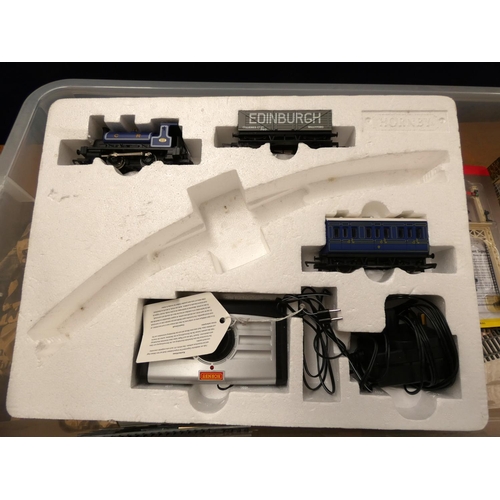 126 - Box of 00 gauge Hornby track and rolling stock.