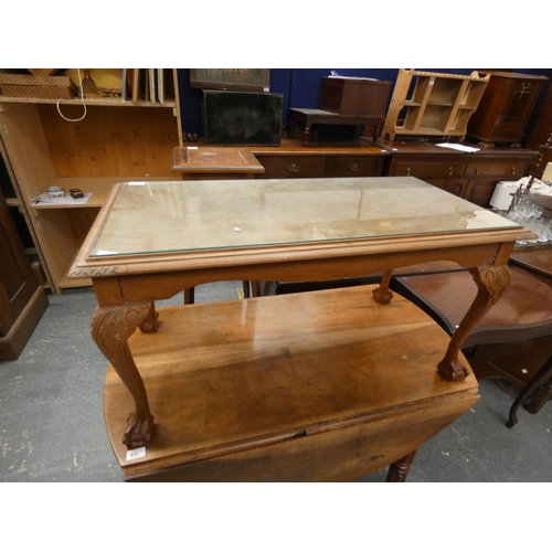 419 - Mahogany glass top coffee table on ball and claw feet.