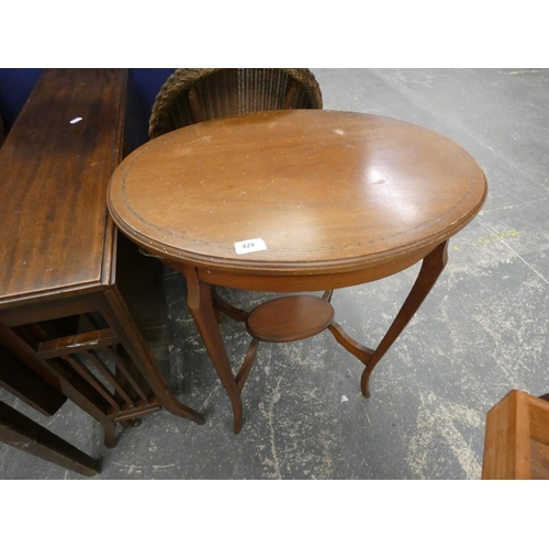 429 - Two tier oval mahogany side table.