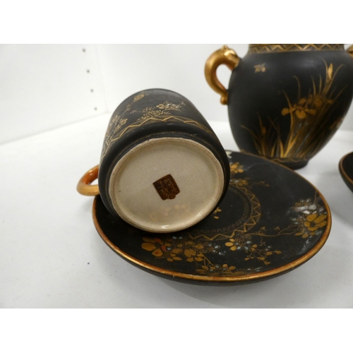 53 - Black and gold Japanese tea set decorated with lotus flower and dragons.