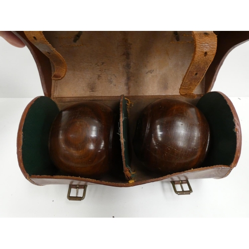 90 - Antique set of bowls in a leather case.