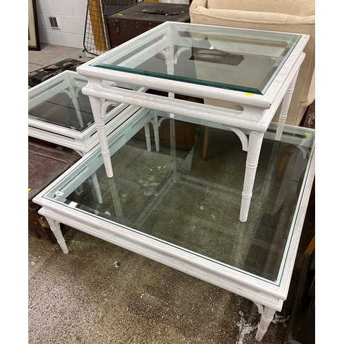 587 - Set of three glass topped coffee tables