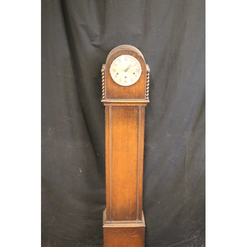 125 - Oak-cased grandmother clock, 140cm tall.