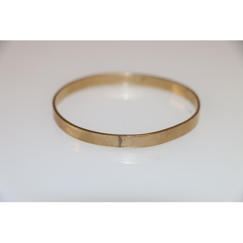 130 - 9ct gold bangle of plain form, 14.9g.