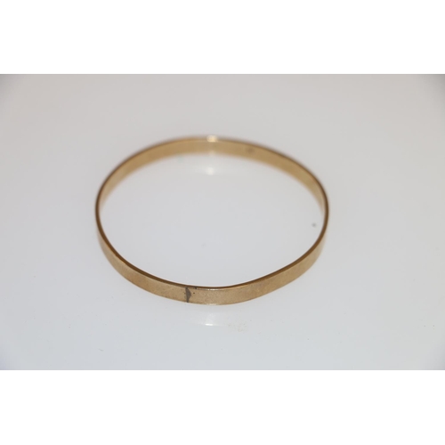 130 - 9ct gold bangle of plain form, 14.9g.